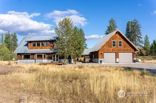 2038 sf Home with attached 2400 sf Garage/ Shop. Upper level over Garage has workout room of your dreams!  1200 sf main level 1200 sf over Garage.