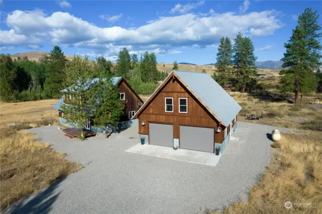 Home and attached Garage shop sited perfectly on this level 2 acre Lot. Great sunny spot. Jump on the Ski Trail within seconds of this homesite.