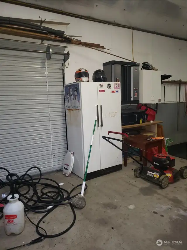 Garage with utility roll up door to the back yard