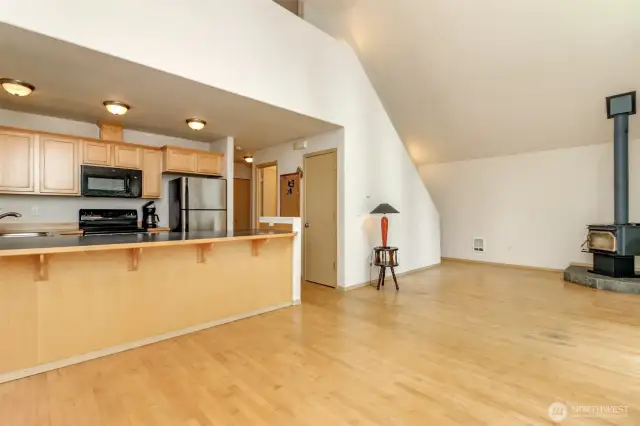 View of kitchen, dining, living