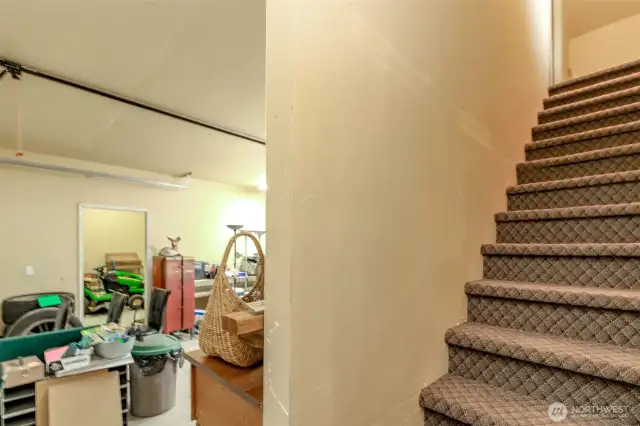 Stairs leading to upstairs finished room in garage