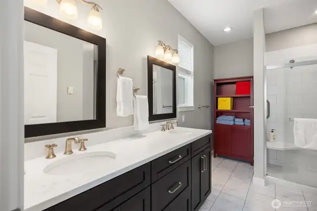 The primary bath has dual sinks, a walk in shower and bidet.