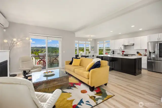 The main living area features a great room design with newly remodeled kitchen, flooring and gas fireplace.