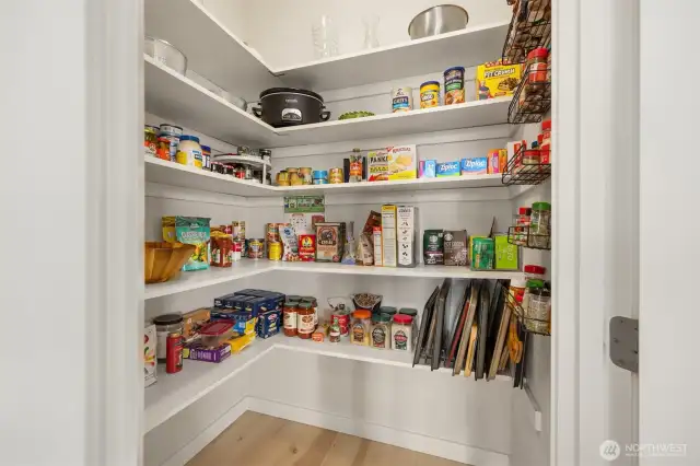 The spacious walk in pantry provides plenty of space for all of your culinary needs.