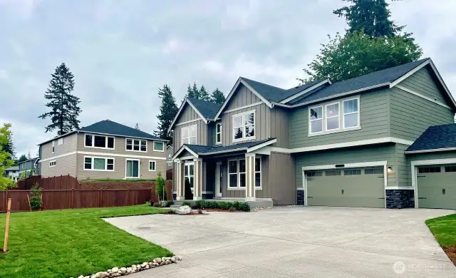 Photo is of actual home under construction. See site agent for details. Large driveway and 3-car garage! Large, private, corner lot!