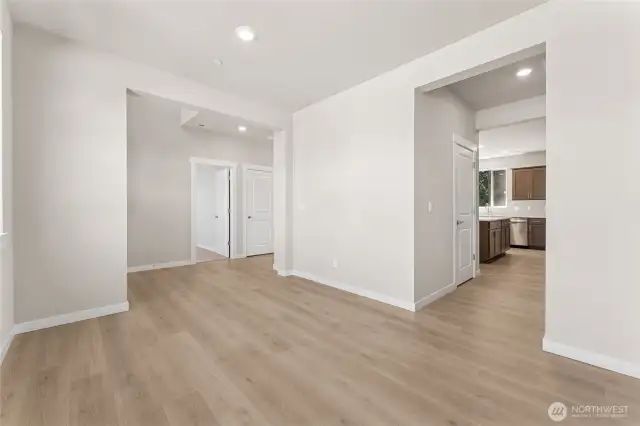 Convenient passthrough from dining room to kitchen of the home perfect for hosting. Photo is representational. Home is under construction and finishes, features, and colors may vary. See site agent for details.