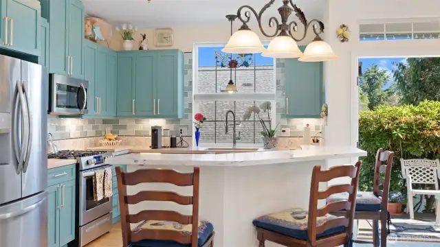 Eat-in kitchen and French doors leading to back covered deck