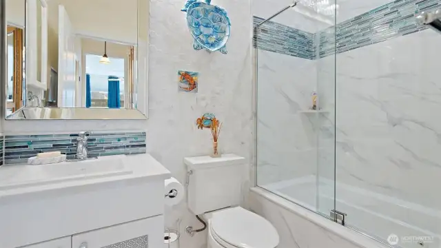 2nd full bathroom with Italian Carrera marble radiant heated floor, designer touches and jetted tub!