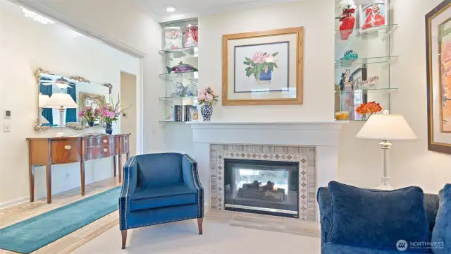 Den/office off of entry with double-sided gas fireplace and custom tile surround