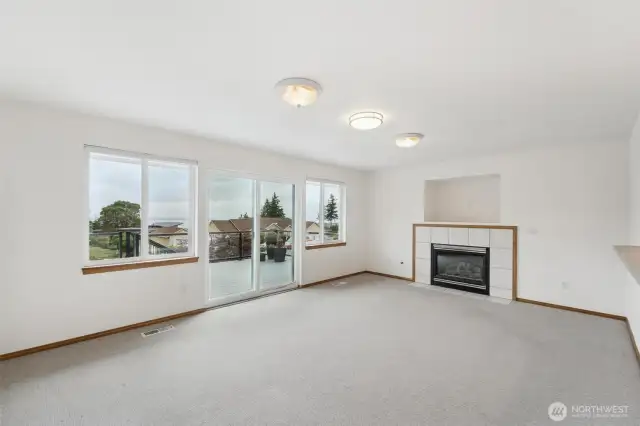 Living room just off the kitchen with deck access.  Perfect for entertaining!