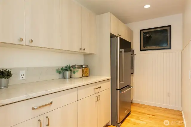 Convenient Butler's pantry adjacent to the kitchen. Extra fridge and wall oven.