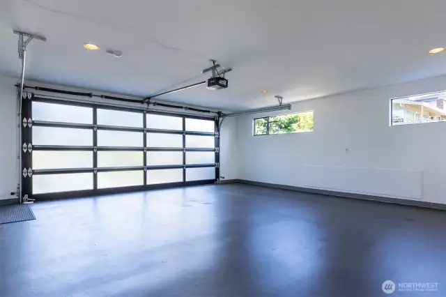 Main level attached  2-car garage. The other attached 2-car garage is accessed via a lower driveway.