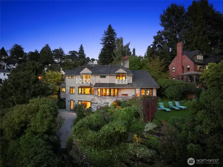 Originally built in 1946 and thoughtfully renovated over the past decade, this 4,150 square foot stone and cedar home exudes storybook charm and classic elegance at every turn.