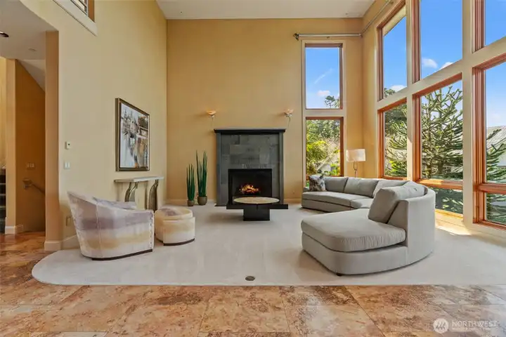 Living room with floor to ceiling windows.