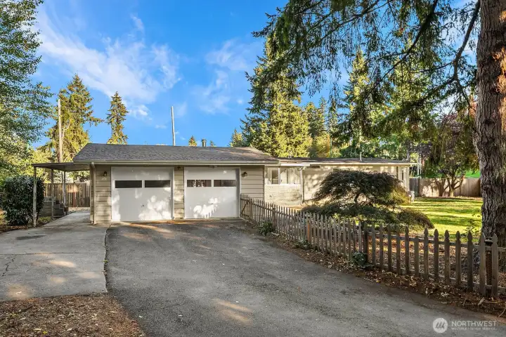 Welcome home to this conveniently located 2 bedroom home with 2 car garage, paved driveway, and plenty of parking.