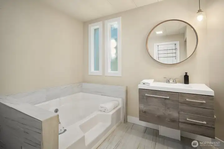Primary bathroom with shower and soaking tub