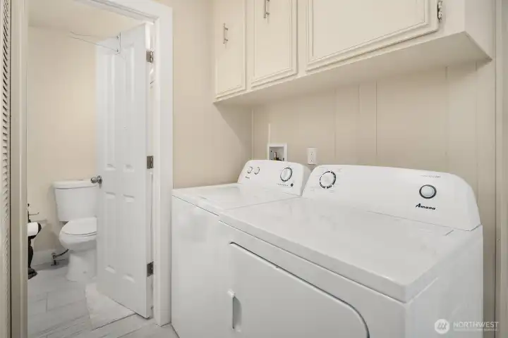 Utility room is just inside the door with a shower just steps away. No need to walk through the house with dirty clothes here!
