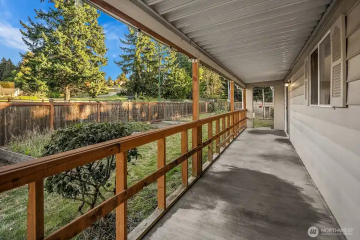 Covered concrete patio in the back.