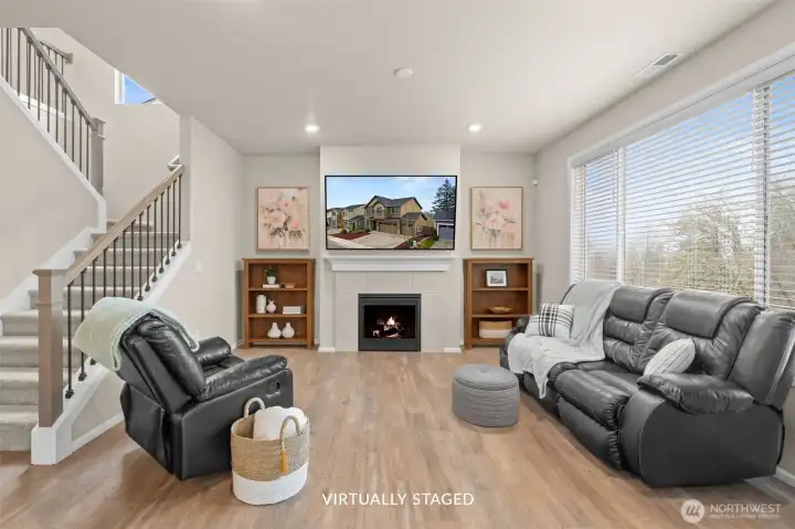 Main-level living room with a cozy gas fireplace (TV and furniture has since been removed).