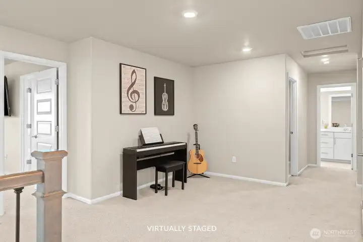 Primary bedroom to the left. This little nook is perfect for hobbies, toys, workout equipment, or reading.