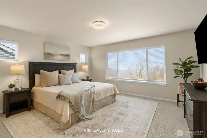 Primary bedroom upstairs, to the left. Window faces the backyard. Separate from other bedrooms.