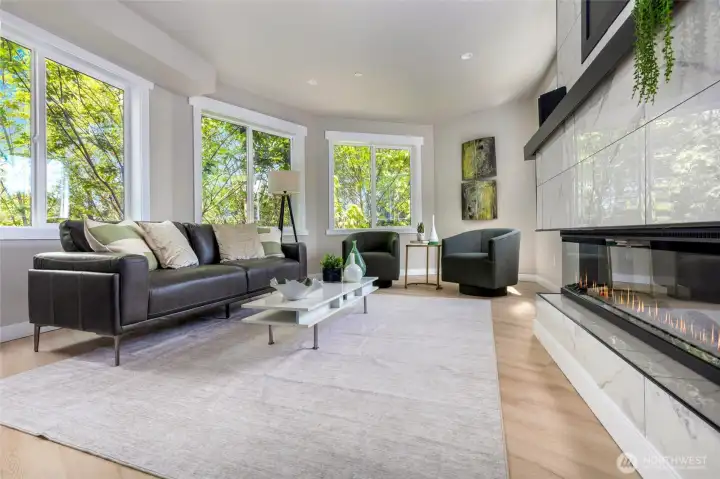 Enjoy the lush green belt from every one of this living room windows - feels very private.