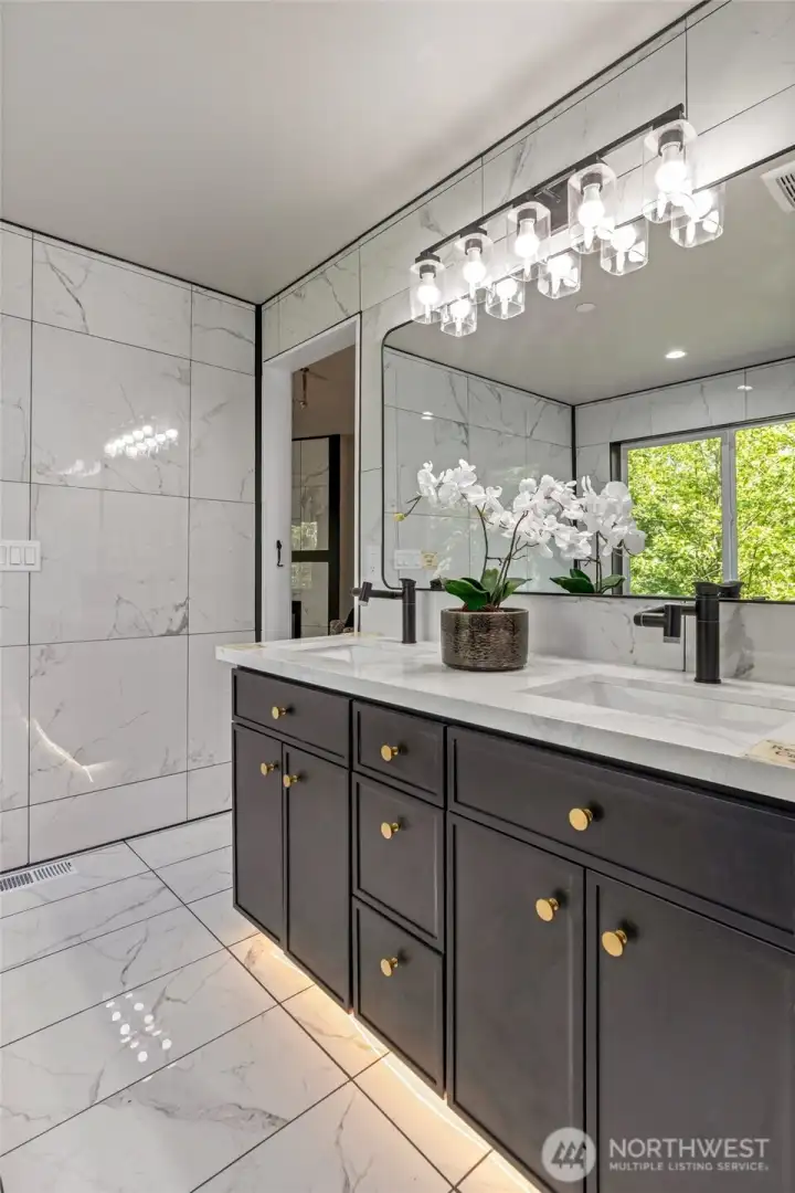 Primary bath with lots of custom and elevated features.