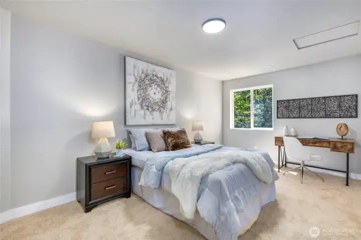 One of the four bedrooms on the upper level.