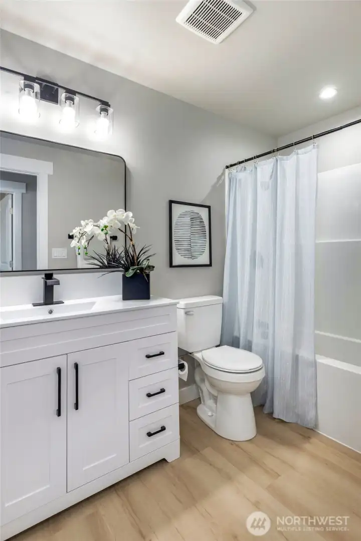 Hall bath on upper level of home.