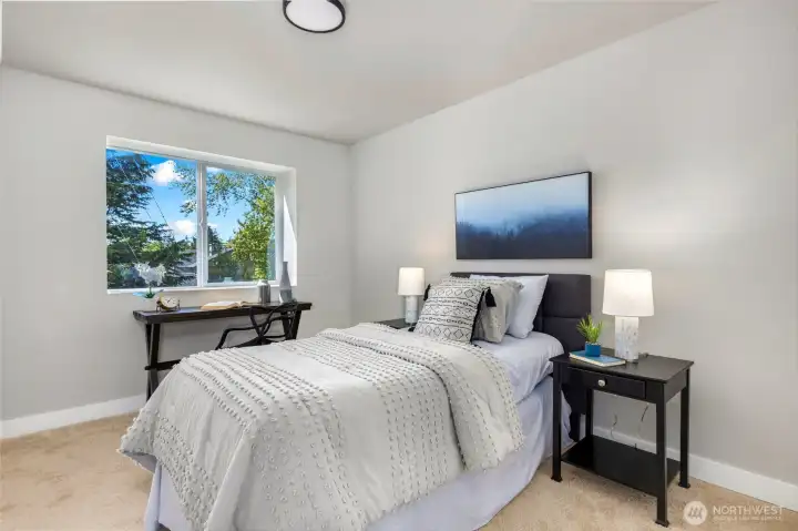 One of the four bedrooms on the upper level.