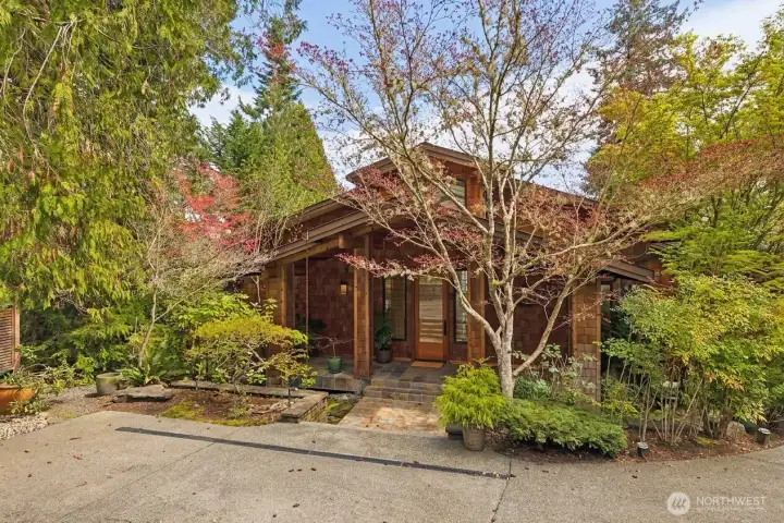 This incredible home splends seamlessly into it's surroundings, but be prepared to be spectacularly surprised as you enter the impressive foyer!