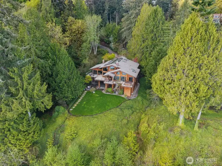 Perched above Budd Inlet in a very private setting...but enjoy an easily walked path to the water's edge