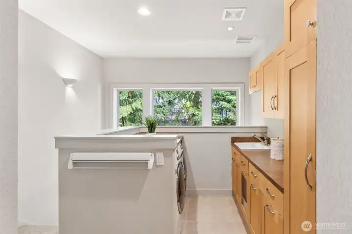 Spacious laundry room with storage galore!