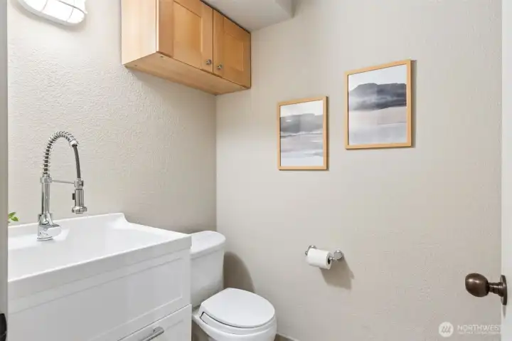 Utility 1/2 bath down at garage level entry