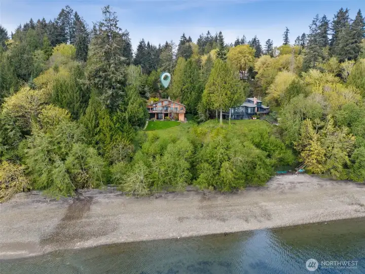 Nestled into a private setting yet filled with natural light and 150' of waterfront footage