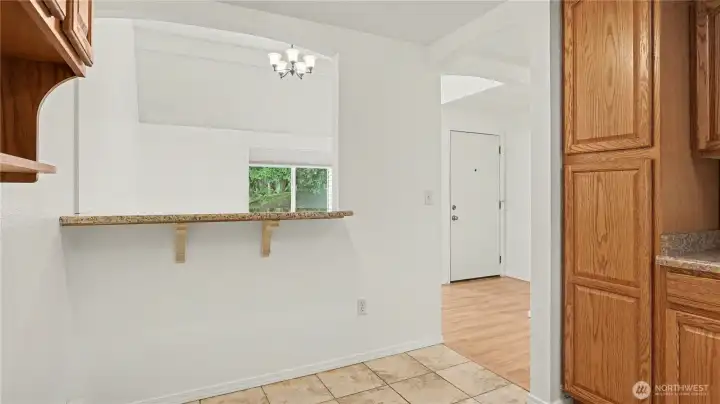 Pass through to the kitchen warmly connects the space.