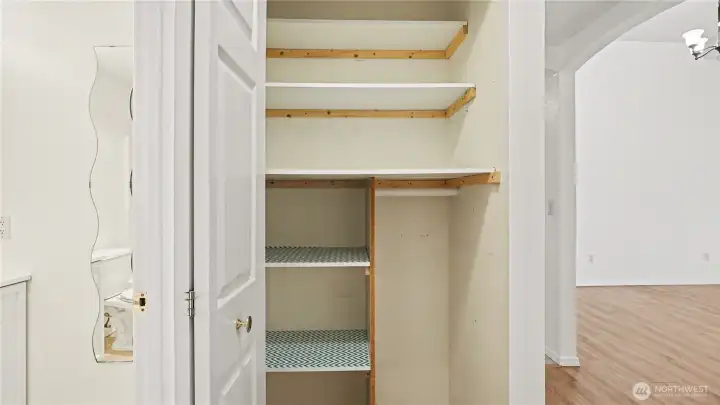Hall closet offers plenty of storage.