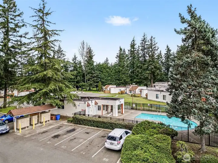 Beautiful complex, surrounded by tall trees and mature landscaping.