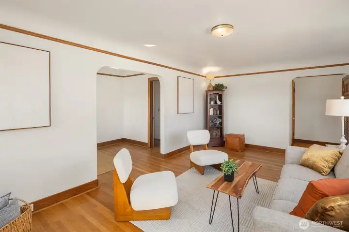 Gorgeous living room with newly finished oak hardwood floor and a inviting wood fireplace