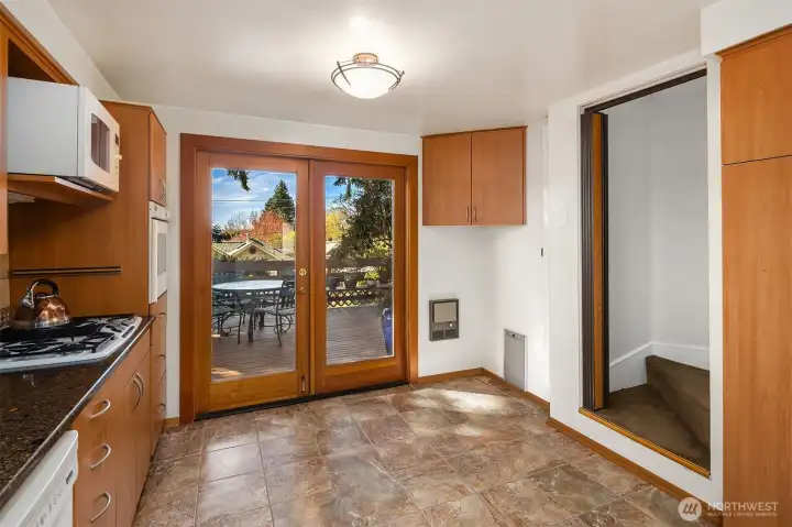 Gorgeous French doors leading to the large deck off the kitchen