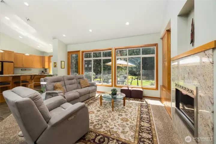 Living area, with propane fireplace, built-in bookshelves and cabinets.