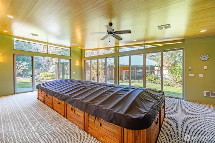 Swim spa/hot tub in the pool house.  There's also a shower in here for easy rinse off.