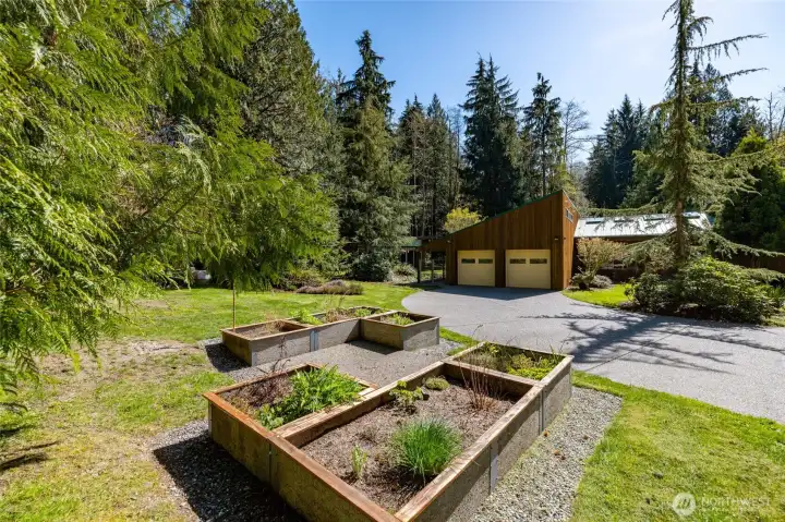 Raised garden beds make gardening a breeze.  Two yard spigots provide convenient access to water.