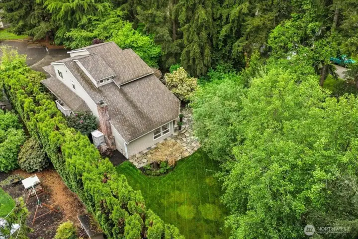 As you can see, this 18,536 sq. ft. lot is surrounded by mature landscaping that lends to a very private peaceful backyard.