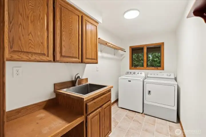Main floor laundry with laundry tub.