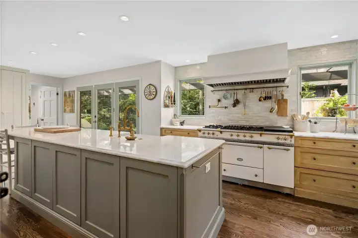 Bright and airy kitchen looks out to the private backyard patio.