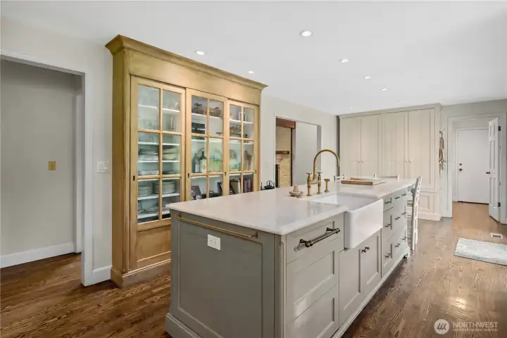 Kitchen with extra deep custom cabinetry built into the wall for extra deep storage.