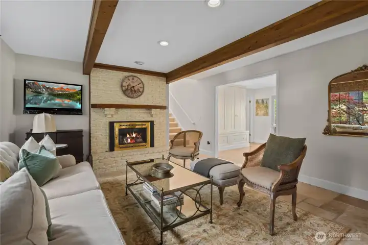 Family room with heated travertine floor and fireplace with xtrodinair insert.