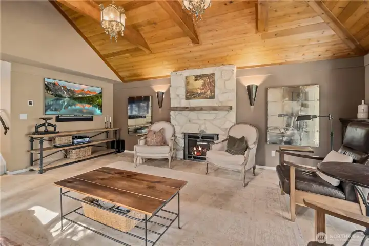 Living room with high ceilings,  fireplace and heated travertine floors.