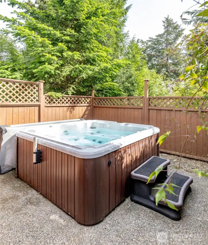 Ease and forget about the day in your own private hot tub area.